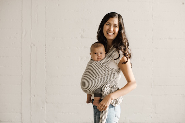 Baby Wraps: The Easy, Cozy Way to Keep Baby Close and Safe, a woman carrying a baby in a baby wrap.