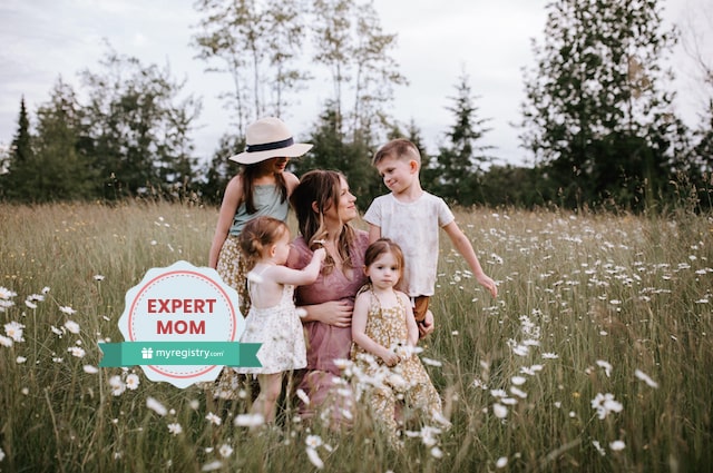 The Baby Products Youll Really Use Those First Six Months, image of Savannah Walsh sitting in a flowery meadow with her five children.
