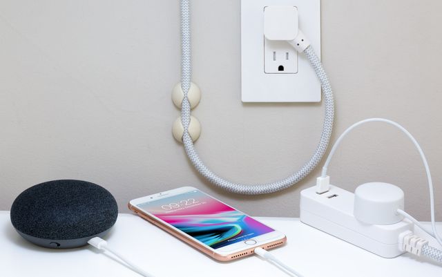 Best Tech Gifts of 2019,  an iphone and several other tech items charging.