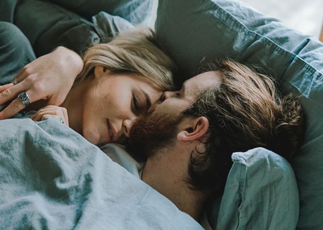 Top 6 Mattresses for Couples, Couple in bed.